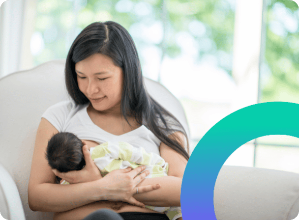 Mum breastfeeding a newborn baby in a chair - an Anya gradient coloured circle segment on the right.